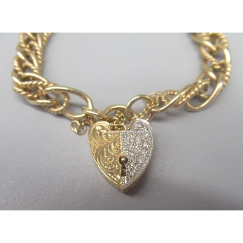 28 - 9ct yellow gold charm bracelet with white and yellow gold heart padlock clasp set with diamonds, sta... 