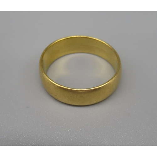 603 - 22ct yellow gold wedding band, stamped 22, size N1/2, 6.1g