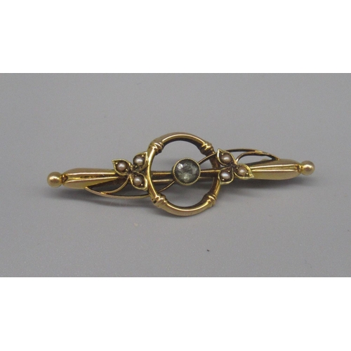 606 - 15ct yellow gold brooch set with single pale blue stone and seed pearls, stamped 15, 2.3g