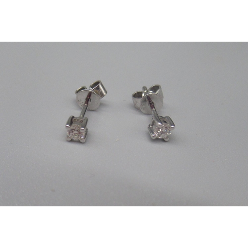 618 - Pair of 9ct white gold diamond stud earrings , stamped 375, and a pair of 9ct yellow gold yellow gol... 