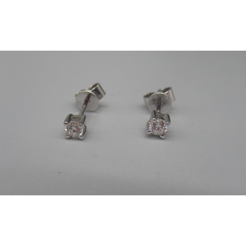 618 - Pair of 9ct white gold diamond stud earrings , stamped 375, and a pair of 9ct yellow gold yellow gol... 