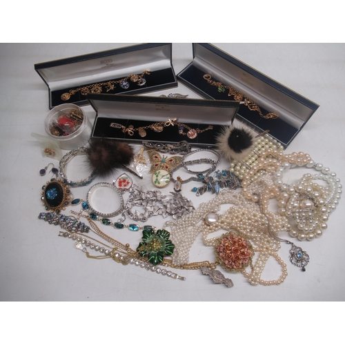 799 - Three Brooks and Bentley yellow metal charm bracelets and a other costume jewellery including brooch... 