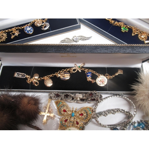 799 - Three Brooks and Bentley yellow metal charm bracelets and a other costume jewellery including brooch... 