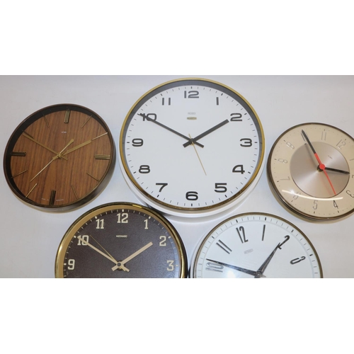 492 - Metamec white finish school wall clock, brass finish bezel enclosing signed white dial with raised A... 