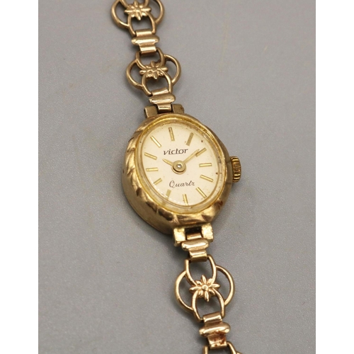 750 - Victor lady's gold cased quartz wristwatch, signed champangne dial with applied baton hour markers, ... 