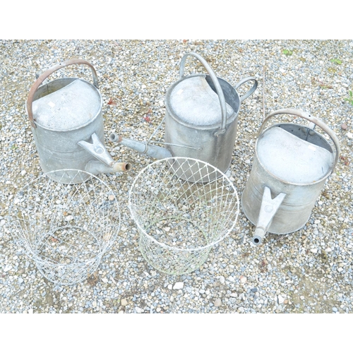 1298 - Three galvanized steel watering cans and 2 wire lattice plant liners