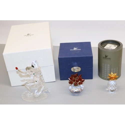 338 - Swarovski Crystal glass ornaments: pineapple H6cm, vase of roses H7cm, and harlequin H13cm, all with... 