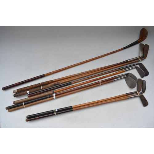 1299 - Collection of 11 vintage hickory handled golf clubs to incl. putters, a Jigger, Niblicks etc, golf b... 