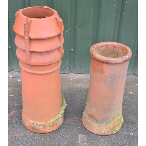 1300 - Fluted and a barrel terracotta chimney pot, and a gun barrel pot (2)