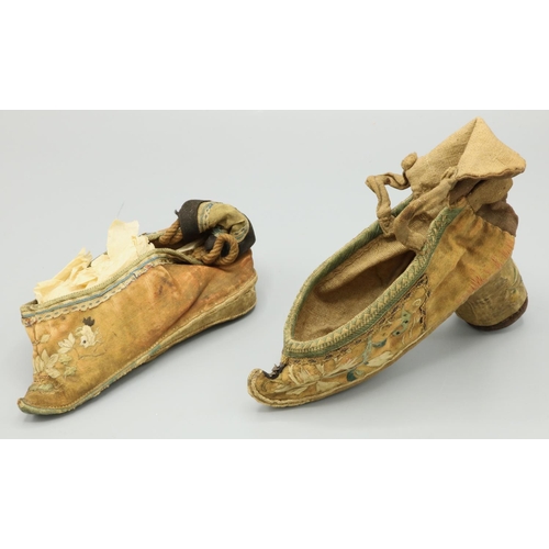 1473 - Two Chinese silk shoes for bound feet, embroidered decoration on pink ground, one shoe with circular... 