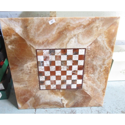 67 - Large heavy marble and stone inlaid chess board, 70.5cm square