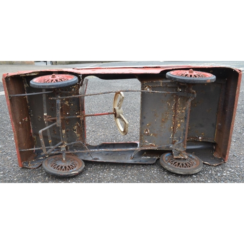 321 - Vintage Triang child's pressed steel pedal car (in need of restoration). Pedal function works, steer... 