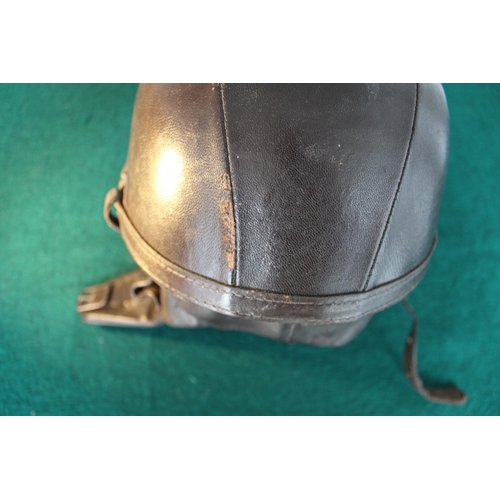 35 - Very early leather racing helmet marked R.M. with a coat of arms depicting a European castle,