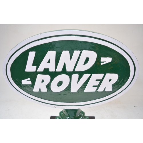 402 - Relief cast metal Land Rover sign on wood base, W40cm D13.5cm H37cm.