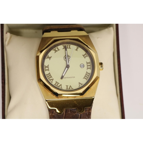 191 - MGB Roadster gold plated quartz wristwatch with date, signed champagne coloured Roman dial with cent... 