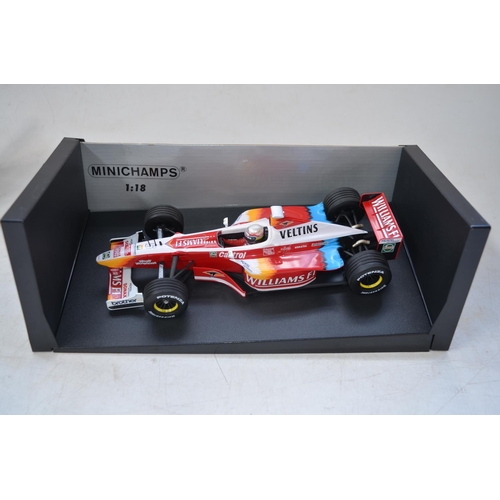 423 - Four Formula 1 diecast racing car models by Minichamps to include a 1/18 scale Williams F1 1st Editi... 