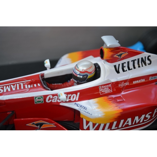 423 - Four Formula 1 diecast racing car models by Minichamps to include a 1/18 scale Williams F1 1st Editi... 