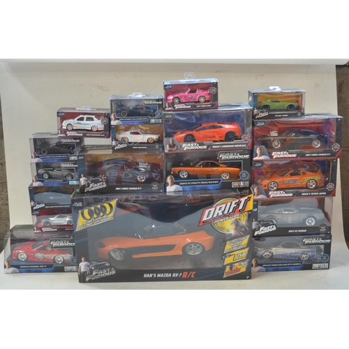 424 - Large collection of boxed diecast Fast & Furious car models by Jada in 1/18th and 1/24th scales. Als... 