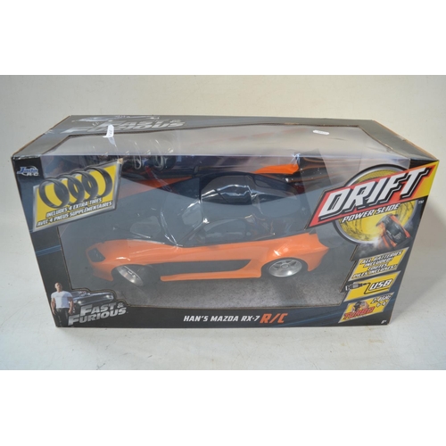 424 - Large collection of boxed diecast Fast & Furious car models by Jada in 1/18th and 1/24th scales. Als... 