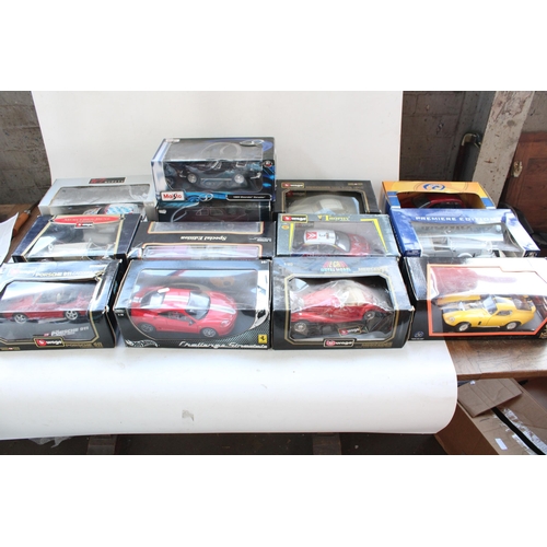 428 - 13x 1/18 scale diecast model vehicles incl. Burago, Maisto, Hot wheels etc.   All boxed.