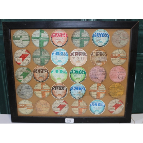 478 - Framed collection of thirty expired tax discs, 1934-1986,  45cm x 55cm