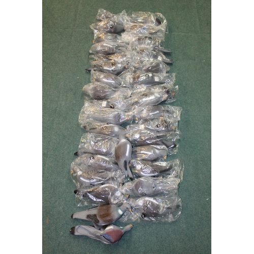 29 - Collection of full bodied plastic wood pigeon decoys, mostly still in wrapper, lacking stand/stake (... 