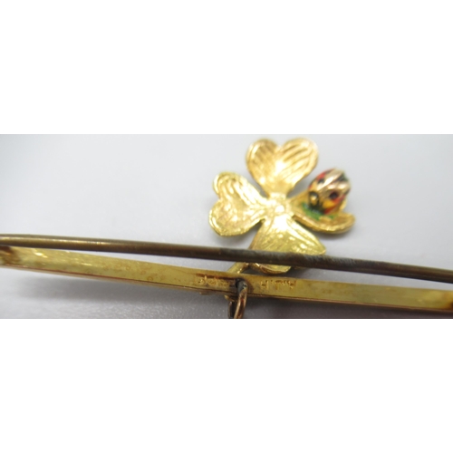 5 - 9ct yellow gold brooch with drop charm depicting a ladybird on a leaf, stamped 375, and a yellow met... 