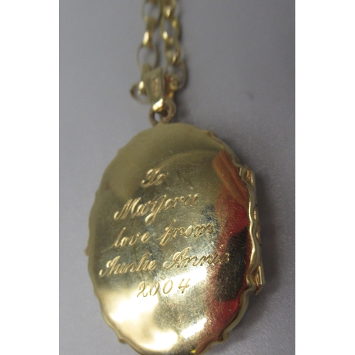 10 - 9ct yellow gold pendant locket necklace with engraving to back, on attached belcher chain, stamped 3... 