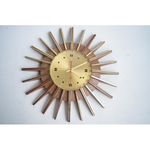 653 - Smiths 1970's battery operated plastic moulded sunburst wall clock, some gold finish rubbed away, so... 