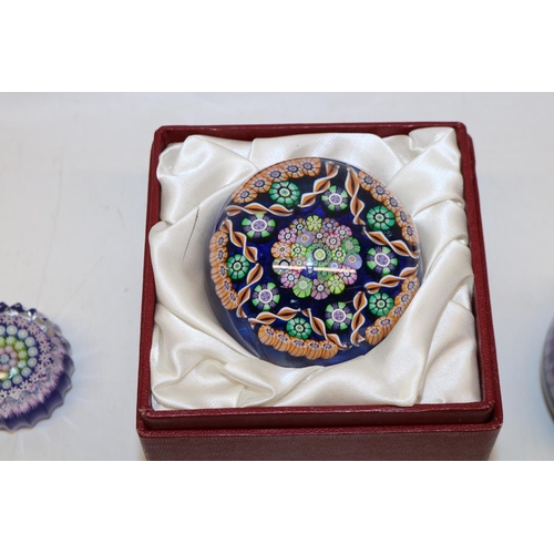 416 - Group of seven Perthshire millefiori glass paperweights, six with signature central 'P' cane, one in... 