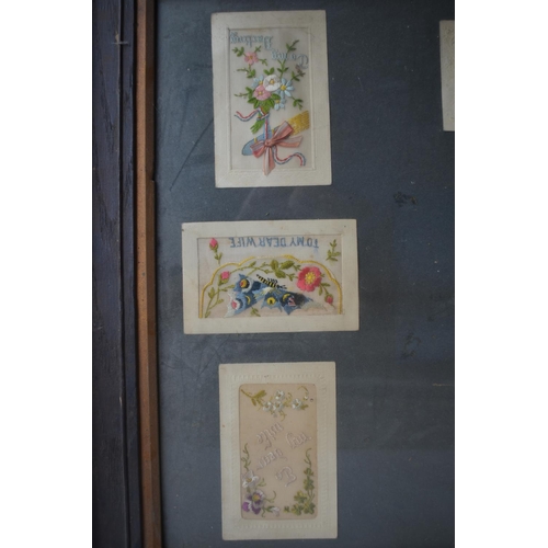 702 - Framed collection of World War 1 postcards to include 8 embroidered silk examples and 2 bouquet card... 