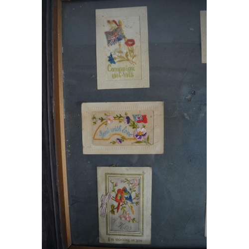 702 - Framed collection of World War 1 postcards to include 8 embroidered silk examples and 2 bouquet card... 