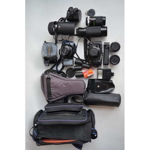 703 - Collection of 35mm SLR cameras and accessories to include Canon A-1 with Canon 28mm and 50mm lenses,... 