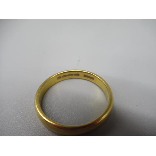 609 - 22ct yellow gold wedding band, stamped 22, size N, 3.7g