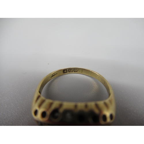 610 - 18ct yellow gold rub over ring, missing one diamond, stamped 18ct, size G, 2.4g, 2.7g