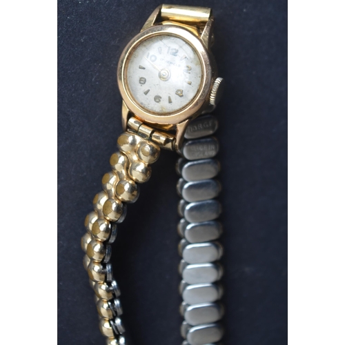 671 - Benfrs Watch Co. - Lady's 18K gold hand wound wristwatch, silvered dial with applied Arabic and bato... 