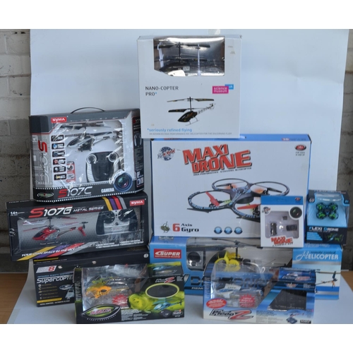 713 - Collection of boxed radio controlled helicopters, drones and cars to include 6 axis gyro stabilised ... 