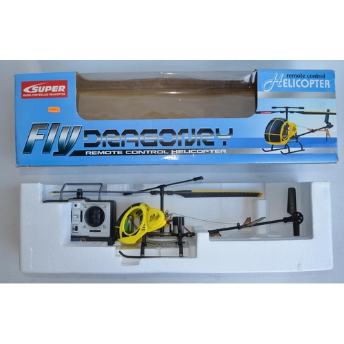 713 - Collection of boxed radio controlled helicopters, drones and cars to include 6 axis gyro stabilised ... 