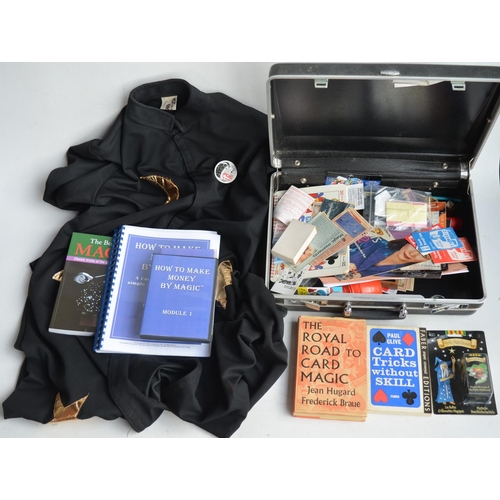 717 - Suitcase containing magic tricks and magic related books and self-learning course manuals. Also incl... 