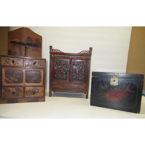 88 - Continental wooden inlaid spice cupboard, a South East Asian painted small cabinet and a Japanese bl... 