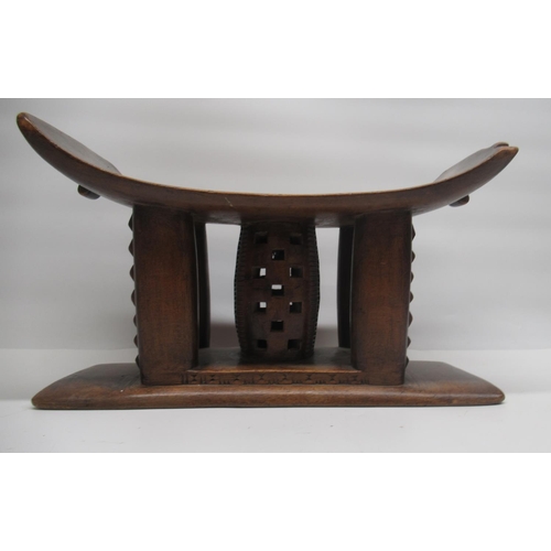 89 - African Ashanti style hardwood head rest with incised and pierced decoration, W45cm H26cm