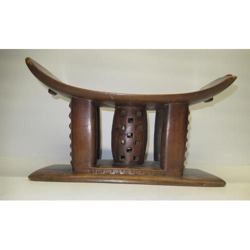 89 - African Ashanti style hardwood head rest with incised and pierced decoration, W45cm H26cm