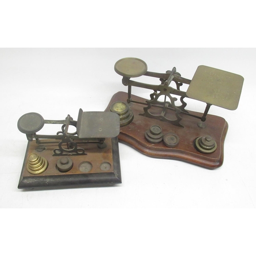 249 - B.W.B.W. early C20th brass postage scales on shaped and moulded mahogany base with matched weights W... 