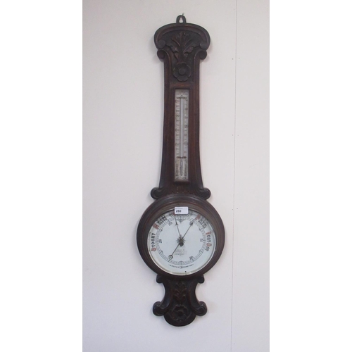 260 - I Henri London - C20th carved oak aneroid wheel barometer with thermometer, H90.5cm