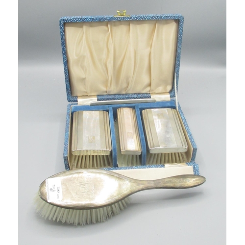 321 - ERII cased silver four piece dressing table set, Daniel Manufacturing Company, Birmingham 1958 and a... 