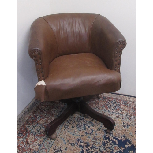 748 - C20th brown leather upholstered office chair on later swivel base (A/F)