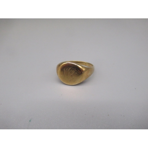 606 - Yellow metal circular signet ring, engraved with initials JW, marks worn, size S, 6.2g