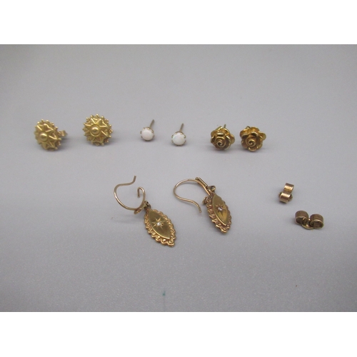 620 - Pair of 9ct yellow gold drop earrings set with single diamond in star cut setting, and three other p... 