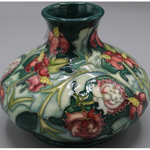 197 - Moorcroft Pottery: Leicester pattern squat vase, tube lined with red and yellow flowers on green gro... 