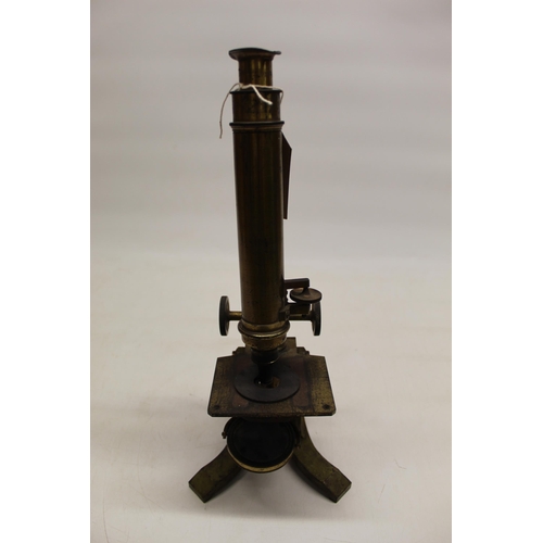 221 - C19th lacquered brass microscope on triform base, no visible maker, H37cm